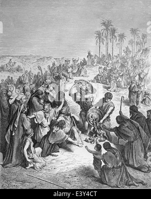 New Testament. Christ feeding the multitude (Matthew 14:17,18). Engraving by Gustave Dore, 1866. Stock Photo