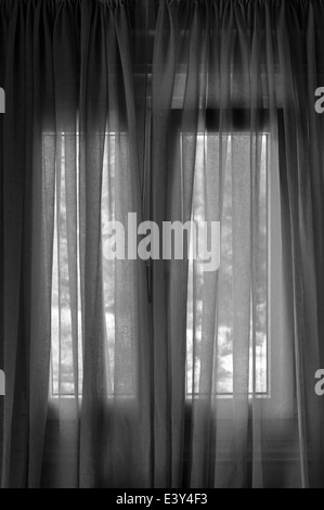 Closed window curtain abstract background. Black and white. Stock Photo