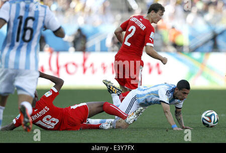 Sao Paulo, Brazil. 1st July, 2014. Argentina's Angel Di Maria (1st R) falls down in a competition with Switzerland's Stephan Lichtsteiner (2nd R) and Gelson Fernandes during a Round of 16 match between Argentina and Switzerland of 2014 FIFA World Cup at the Arena de Sao Paulo Stadium in Sao Paulo, Brazil, on July 1, 2014. Credit:  Wang Lili/Xinhua/Alamy Live News Stock Photo