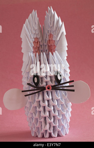 origami bunny rabbit isolated on pink background Stock Photo