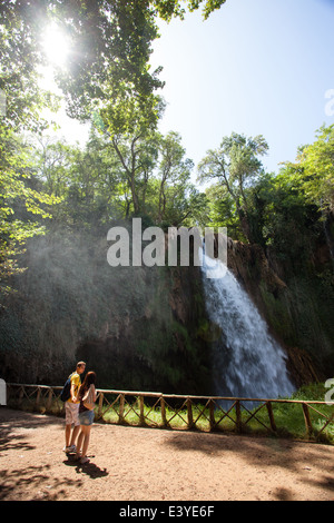 Couple looking a waterfall in Monasterio de Piedra (Stone Monastery), in Aragón, Spain Stock Photo