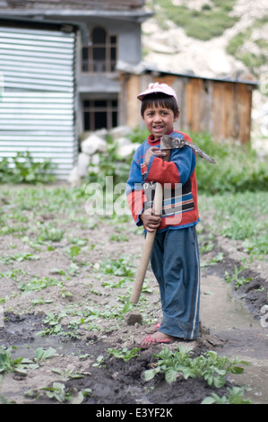 Child working in Kinnaur Valley. Stock Photo