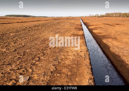 A raised bog being harvested for peat near Douglas water in the Southern Uplands of Scotland. Stock Photo