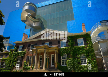 South wing of the blue titanium Ontario Art Gallery designed by Gehry over the historic Grange manor Toronto Stock Photo