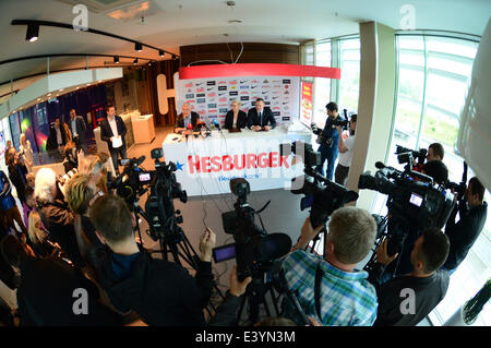 Vilnius, Lithuania. 1st July, 2014. Jonas Kazlauskas (center L), head coach of the national basketball team of Lithuania, attends a news conference in Vilnius, Lithuania, July 1, 2014. Jonas Kazlauskas announced the list of 17 candidates invited to prepare for FIBA 2014 Basketball World Cup which will be held from August 30 to September 14 in six Spain cities, including Madrid, Barcelona, etc. © Alfredas liadis/Xinhua/Alamy Live News Stock Photo