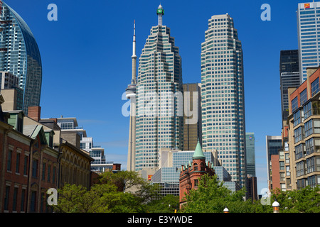 View of Gooderham Flatiron building against financial district bank towers and CN tower Toronto from St Lawrence Market Front Street