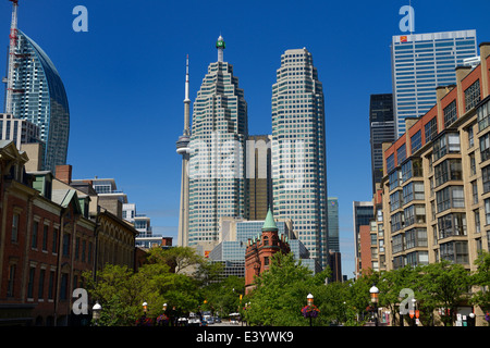 Gooderham Flatiron building with financial district bank towers, L tower, and CN tower Toronto in summer from St Lawrence Market Front Street