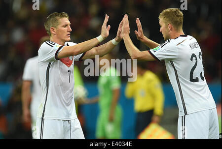 Porto Alegre, Brazil. 30th June, 2014. Germany's Bastian Schweinsteiger (L) is substituted for Christoph Kramer during the FIFA World Cup 2014 round of 16 soccer match between Germany and Algeria at the Estadio Beira-Rio in Porto Alegre, Brazil, 30 June 2014. Photo: Andreas Gebert/dpa/Alamy Live News Stock Photo