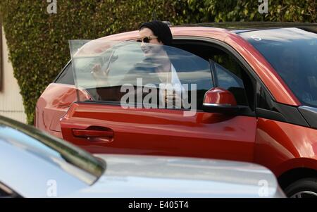 Anne Hathaway getting out of her new BMW i3 electric car  Featuring: Anne Hathaway Where: Los Angles, California, United States When: 06 Dec 2013 Stock Photo