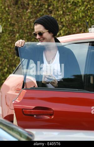 Anne Hathaway getting out of her new BMW i3 electric car  Featuring: Anne Hathaway Where: Los Angles, California, United States When: 06 Dec 2013 Stock Photo