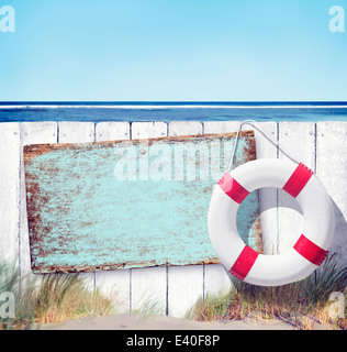 Wooden Fence and Empty Label on Beach Stock Photo