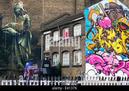 England, London, Shoreditch, Christina Street, graffiti wall painting of the artists Inkfetish, Jimmy Jasik and Poer and graffito of female artist Faith47 Stock Photo