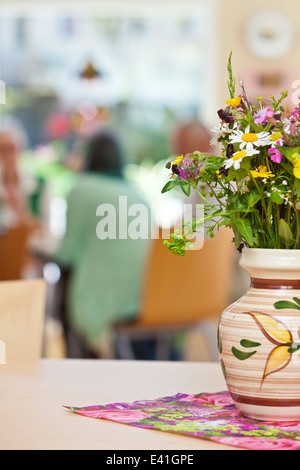 Senior Community in a retirement home having breakfast Stock Photo