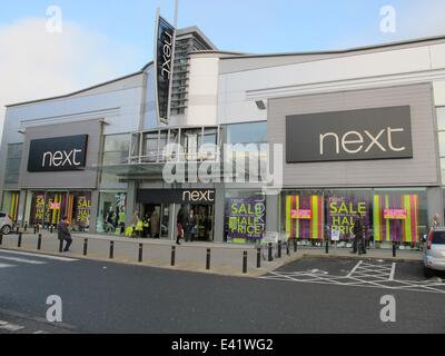 The retail park at London Colney was busy as the Boxing Day sales started. The car park was quickly filled before the shops opened. A nearby Tesco reduced the price of all its' turkeys.  Featuring: London Colney retail park Next Where: London, United King Stock Photo