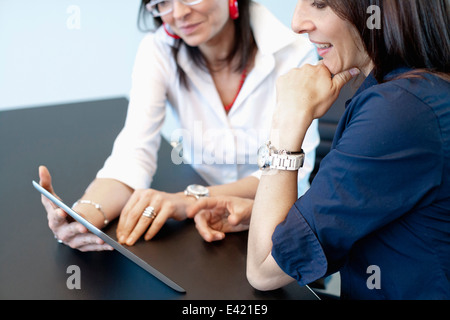 Businesswomen using digital tablet Stock Photo