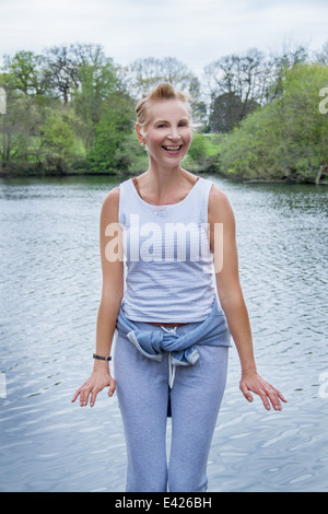 Portrait of mature woman exercising in park Stock Photo