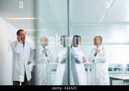 Doctors chatting at office Stock Photo