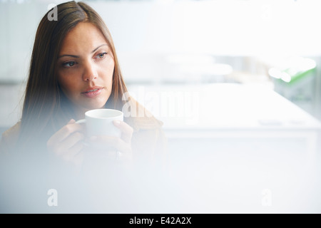 Woman taking a coffee break Stock Photo - Alamy