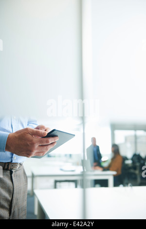 Male hands holding digital tablet Stock Photo