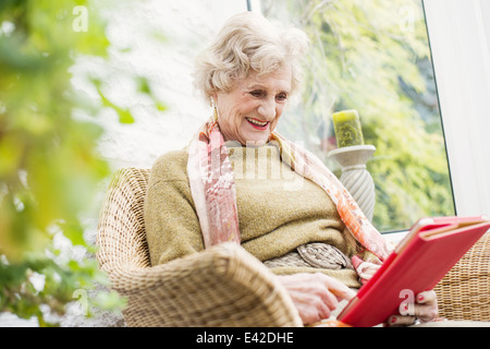Senior woman using digital tablet Stock Photo
