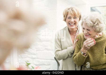 Senior woman with daughter, laughing Stock Photo