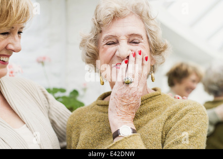 Senior woman with daughter, laughing Stock Photo