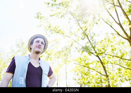 Young man wearing straw hat, low angle Stock Photo