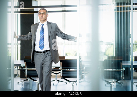 Businessman at entrance of meeting room Stock Photo