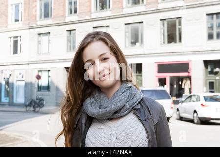 Portrait of teenage girl on city street Stock Photo