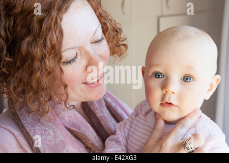 Portrait baby girl and mid adult mother Stock Photo