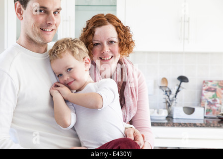 Portrait of mid adult couple and four year old son Stock Photo