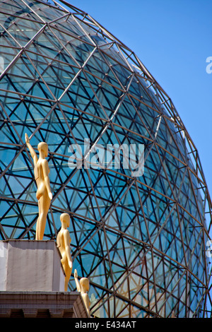 Rooftop sphere detail with the golden sculpture of the standing men Stock Photo