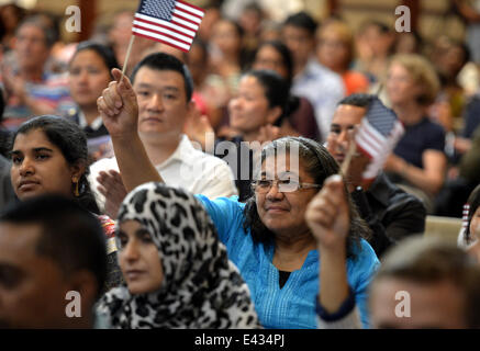 New York, USA. 2nd July, 2014. New U.S. citizens take part in an United States naturalization ceremony ahead of Independence Day, in New York City, the United States, July 2, 2014. A naturalization ceremony was held in New York City by U.S. Citizenship and Immigration Services to welcome America's newest citizens who originate from 47 countries. The U.S. Citizenship and Immigration Services welcomed approximately 7,800 new U.S. citizens during more than 95 naturalization ceremonies across the country from June 30 to July 5. © Wang Lei/Xinhua/Alamy Live News Stock Photo
