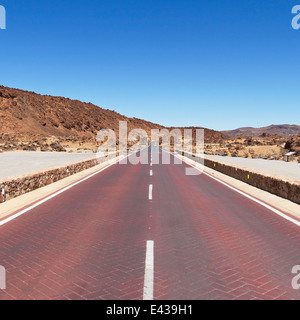 Red road through Minas San Jose in the Teide National Park in Tenerife, Spain. Stock Photo