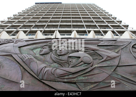 A bas relief sculpture featuring a cosmonaut on a building near Alexanderplatz in Berlin, Germany. Stock Photo