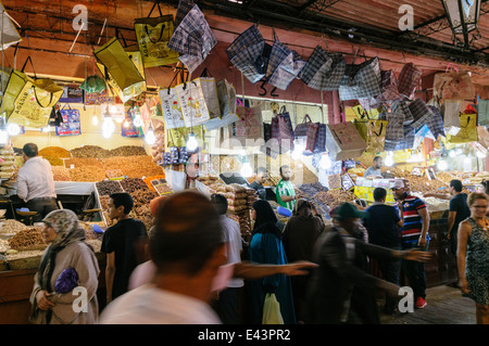 Many stalls sell dried fruit and nuts at the souq at the Jemeaa El-Fna Fnaa Square souk at night, Marrakech, Morocco. Stock Photo