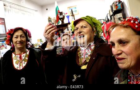 Bulgarian women dressed up for a carnival perform in celebration of the Midwives' Day in the village of Topoli east of the Bulgarian capital Sofia. Midwives' Day is one of the most popular holiday in Bulgaria and it is a patron of the women who work as do Stock Photo