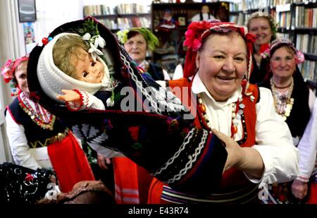 Bulgarian women dressed up for a carnival perform in celebration of the Midwives' Day in the village of Topoli east of the Bulgarian capital Sofia. Midwives' Day is one of the most popular holiday in Bulgaria and it is a patron of the women who work as do Stock Photo