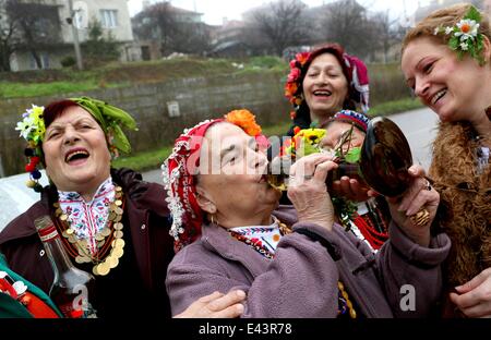 Bulgarian women dressed up for a carnival perform in celebration of the Midwives' Day in the village of Topoli east of the Bulgarian capital Sofia. Midwives' Day is one of the most popular holiday in Bulgaria and it is a patron of the women who work as do Stock Photo