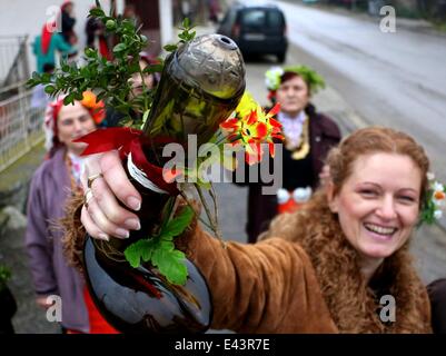 Bulgarian women dressed up for a carnival perform in celebration of the Midwives' Day in the village of Topoli east of the Bulgarian capital Sofia. Midwives' Day is one of the most popular holiday in Bulgaria and it is a patron of the women who work as do Stock Photo