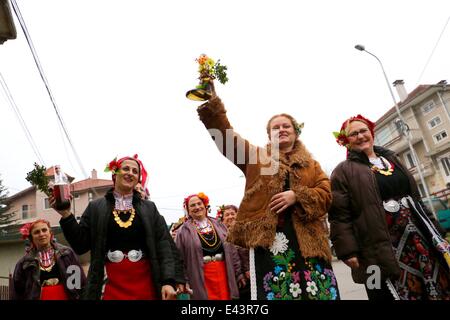 Bulgarian women dressed up for a carnival perform in celebration of the Midwives' Day in the village of Topoli east of the Bulgarian capital Sofia. Midwives' Day is one of the most popular holiday in Bulgaria and it is a patron of the women who work as do Stock Photo