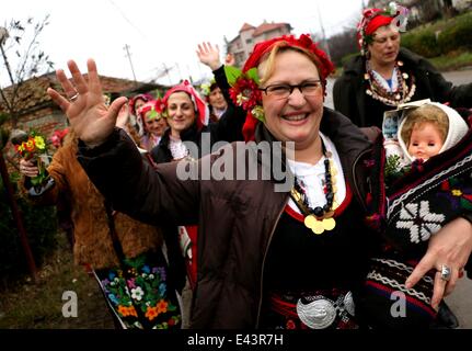 Bulgarian women dressed up for a carnival perform in celebration of the Midwives' Day in the village of Topoli east of the Bulgarian capital Sofia. Midwives' Day is one of the most popular holiday in Bulgaria and it is a patron of the women who work as do Stock Photo