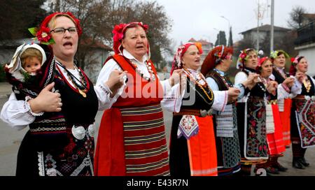 Bulgarian women dressed up for a carnival perform in celebration of the Midwives' Day in the village of Topoli east of the Bulgarian capital Sofia. Midwives' Day is one of the most popular holiday in Bulgaria and it is a patron of the women who work as do Stock Photo