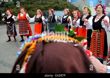 Bulgarian women dressed up for a carnival perform in celebration of the Midwives' Day in the village of Topoli east of the Bulgarian capital Sofia. Midwives' Day is one of the most popular holiday in Bulgaria and it is a patron of the women who work as do Stock Photo