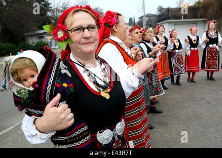 Bulgarian women dressed up for a carnival perform in celebration of the Midwives' Day in the village of Topoli east of the Bulgarian capital Sofia. Midwives' Day is one of the most popular holiday in Bulgaria and it is a patron of the women who work as do Stock Photo