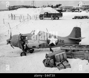 This photograph shows a damaged F4F Wildcat aircraft from the USS Midway, a pivotal aircraft carrier during World War II. The F4F Wildcat played a crucial role in naval aviation during the Pacific Theater of the war. Stock Photo