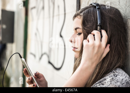 Girl listening to music on smartphone