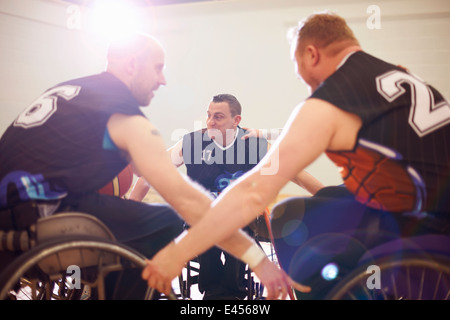 Wheelchair basketball players display team encouragement Stock Photo