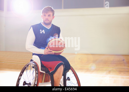 Wheelchair basketball player holding ball Stock Photo
