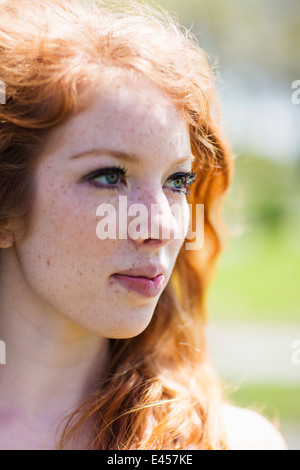 Portrait of a young red haired woman